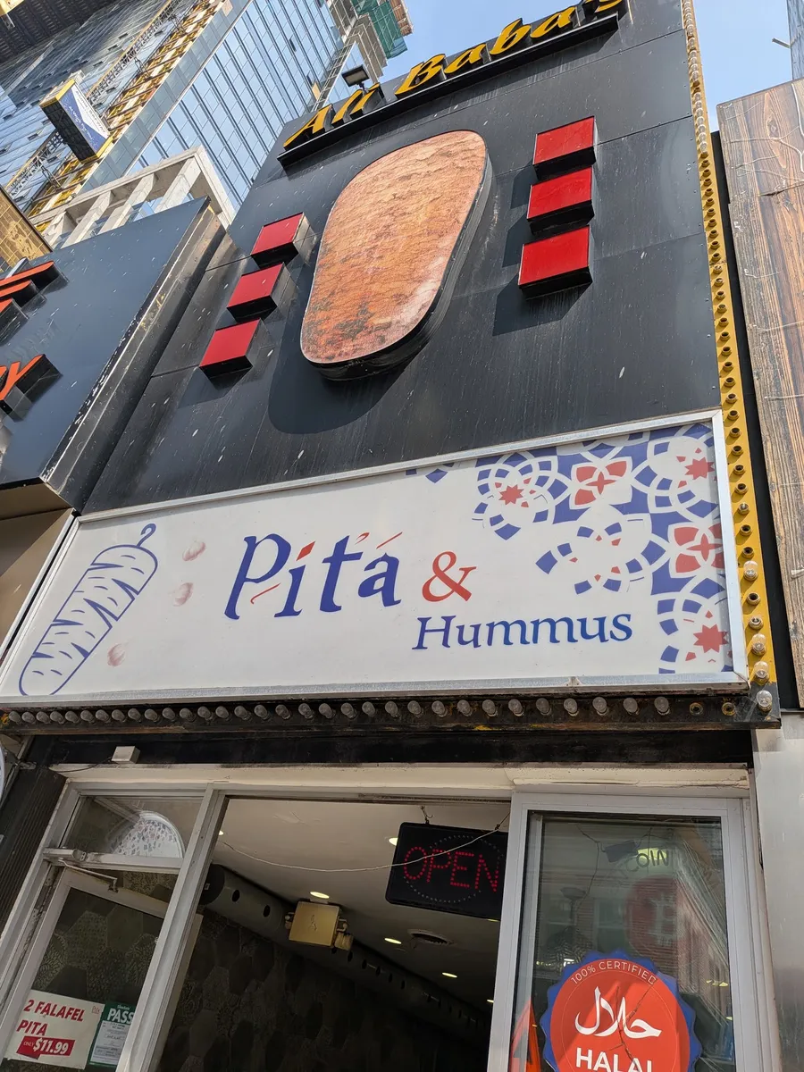 The Pita & Hummus sign at 357 Yonge St